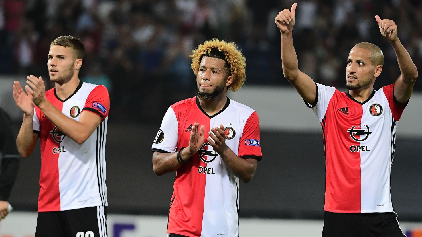 Bart Nieuwkoop, goalscorer Tonny Trindade and Karim El Ahmadi celebrate Feyenoord's win. 