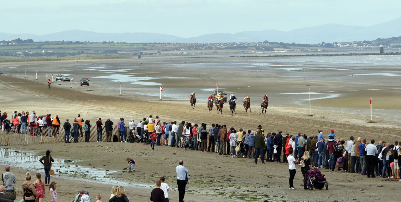 Horses gallop along the Laytown beach course. 