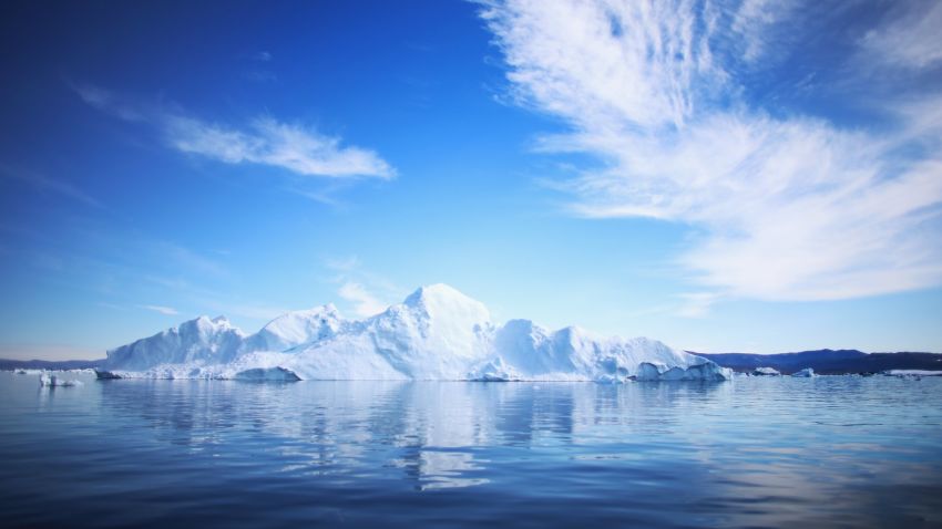 ILULISSAT, GREENLAND - JULY 20: An iceberg floats through the water on July 20, 2013 in Ilulissat, Greenland. As Greenlanders adapt to the changing climate and go on with their lives, researchers from the National Science Foundation and other organizations are studying the phenomena of the melting glaciers and its long-term ramifications for the rest of the world. In recent years, sea level rise in places such as Miami Beach has led to increased street flooding and prompted leaders such as New York City Mayor Michael Bloomberg to propose a $19.5 billion plan to boost the citys capacity to withstand future extreme weather events by, among other things, devising mechanisms to withstand flooding. (Photo by Joe Raedle/Getty Images) (Photo by Joe Raedle/Getty Images)