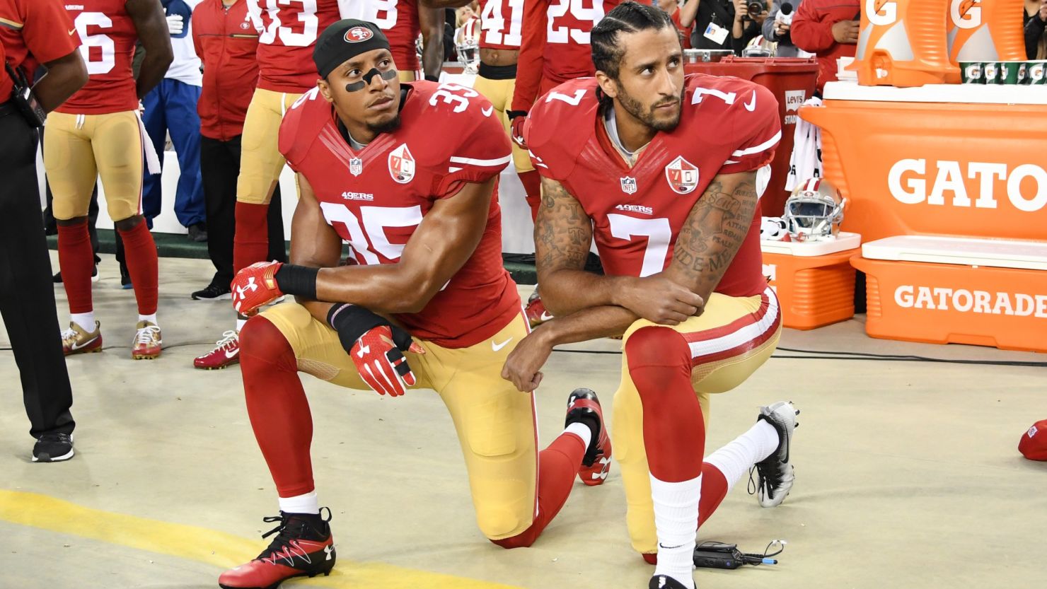 Colin Kaepernick, right, and Eric Reid of the San Francisco 49ers kneel in protest during the national anthem prior to a game against the Los Angeles Rams on September 12.