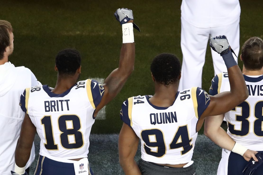 Kenny Britt #18 and Robert Quinn #94 of the Los Angeles Rams raise their fists in protest prior to playing the San Francisco 49ers on September 12, 2016 in Santa Clara, California.