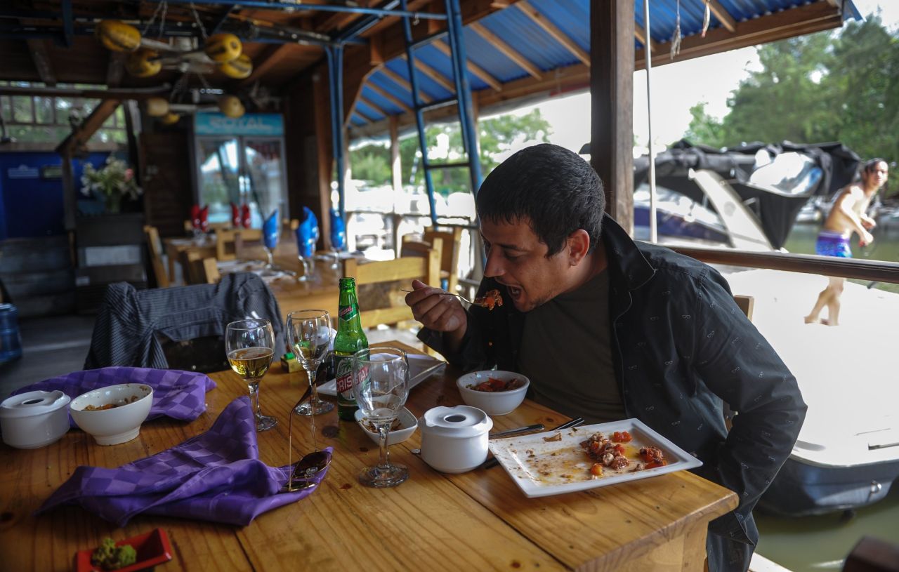 A man eats in a private restaurant in Havana where the lionfish is served.<br /><br />There are increasing efforts to reduce the lionfish population by marketing them as food, with conservation group REEF producing a dedicated cookbook. 