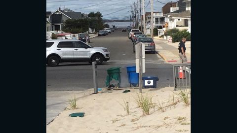 An explosive damaged this green garbage can on the morning of Saturday, September 17, 2016. The can was along what was to be the route for a Marine Corps charity run in Seaside Park, New Jersey, the Ocean County prosecutor's office said.