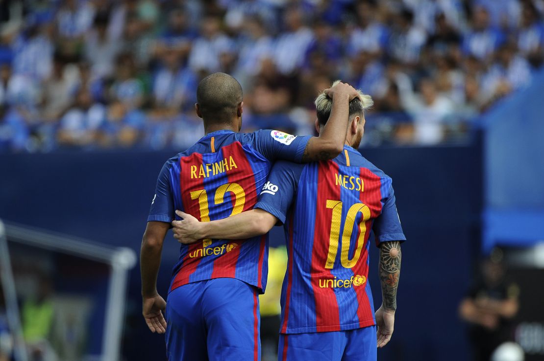 Rafinha celebrates his stunning goal with Lionel Messi.