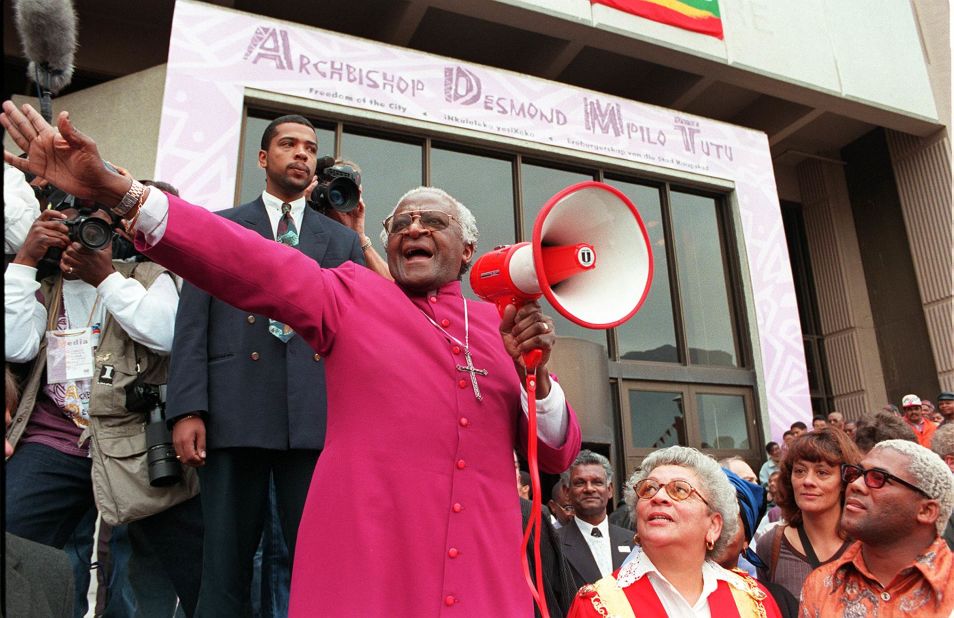 Tutu joyfully shouts "I am free! We are all free!" outside the Civic Centre in Cape Town in 1998. It was before a ceremony where he received the Freedom of the City award. In 1998, Tutu retired as the archbishop of Cape Town and became archbishop emeritus.