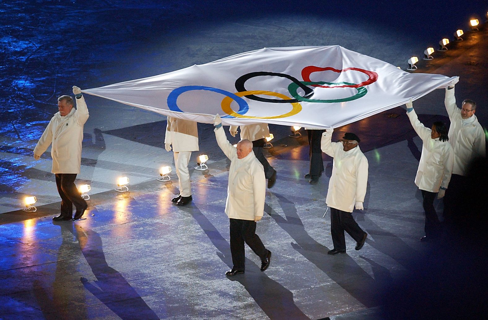 Tutu and other dignitaries escort the Olympic flag during the opening ceremony of the 2002 Winter Olympics in Salt Lake City.