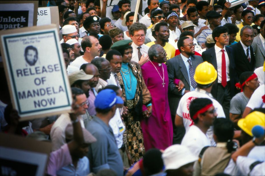 Tutu and Winnie Mandela march in Cape Town to protest the continued imprisonment of anti-apartheid leader Nelson Mandela in February 1990. Later that day, South African President F.W. de Klerk would announce Mandela's release.