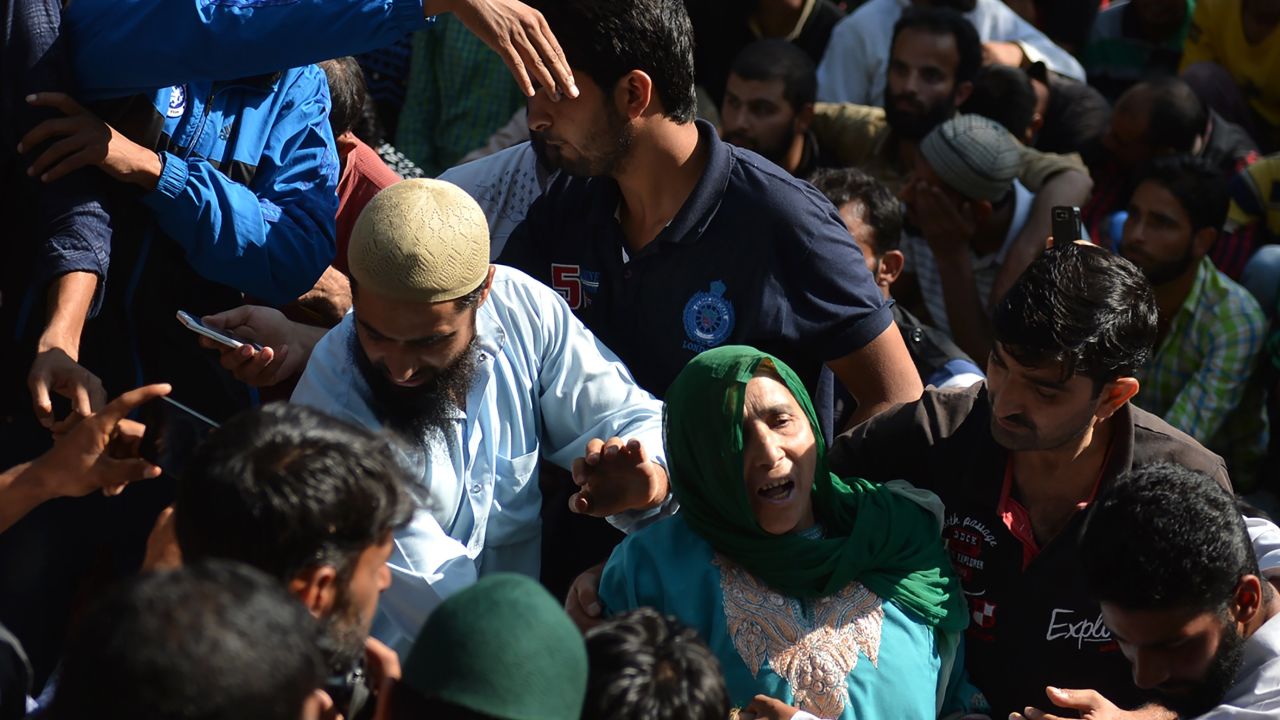 Mourners attend Nasir Shafi's funeral on Saturday.
