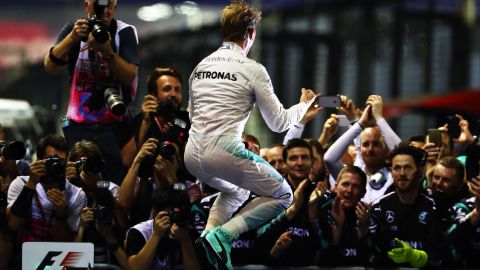 Nico Rosberg of Germany celebrates his Singapore GP win in parc ferme.