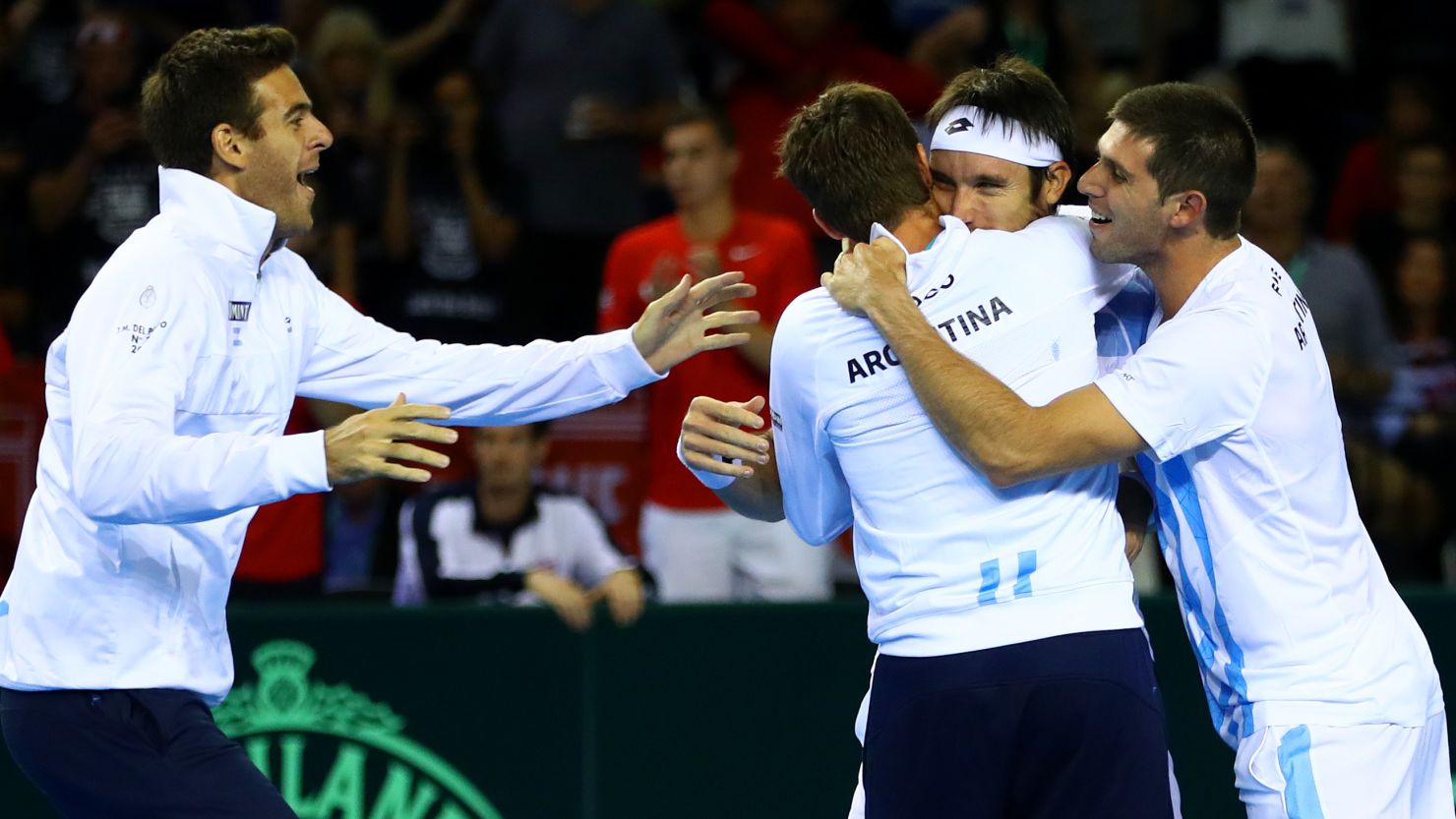  Argentina's tennis players celebrate Mayer's decisive victory in the Davis Cup semifinal against Britain.  