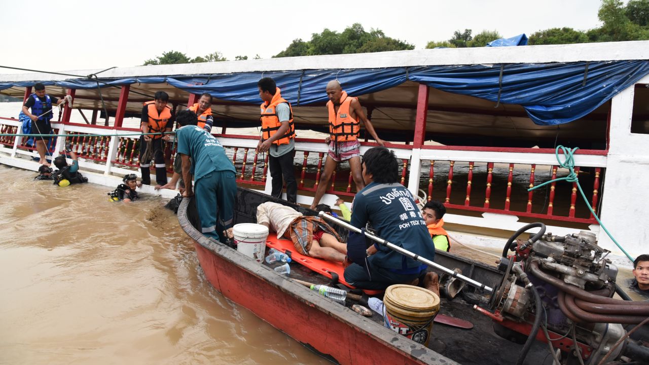 Thai rescuers work to help survivors of a capsized ferry on September 18, 2016. 