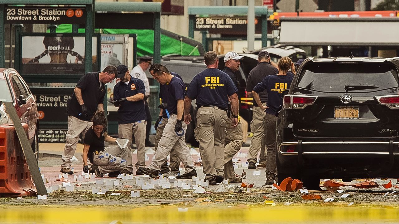 FBI agents review the scene of the explosion on Sunday morning.