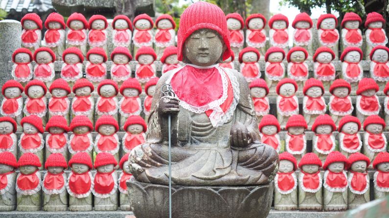 Rows of ojizosan statues at Jison-In. According to animist beliefs, the statues represent the guardian of children and travelers. 