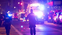 TOPSHOT - Police and first responders walk down a blocked off road near the site of an alleged bomb explosion on West 23rd Street on September 17, 2016, in New York.
An explosion in New York's upscale and bustling Chelsea neighborhood injured at least 25 people, none of them in a life-threatening condition, late Saturday, the fire department said. / AFP / Bryan R. Smith        (Photo credit should read BRYAN R. SMITH/AFP/Getty Images)