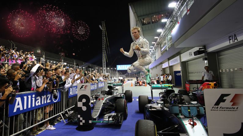 Formula One driver Nico Rosberg jumps off his car as he celebrates <a href="index.php?page=&url=http%3A%2F%2Fwww.cnn.com%2F2016%2F09%2F18%2Fmotorsport%2Fsingapore-f1-rosberg-hamilton%2Findex.html" target="_blank">victory in the Singapore Grand Prix</a> on Sunday, September 18. It was the eighth win of the season for Rosberg, who reclaimed the standings lead from Mercedes teammate Lewis Hamilton.