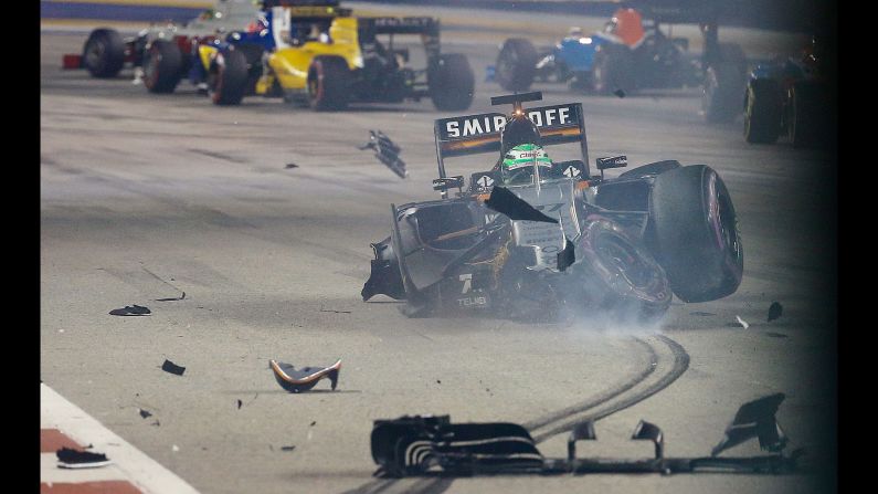 Formula One driver Nico Hulkenberg crashes at the start of the Singapore Grand Prix on Sunday, September 18. He was not hurt.