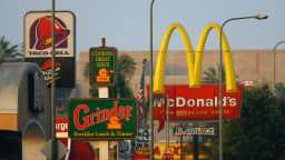 LOS ANGELES, CA - JULY 24:  Fast-food restaurants signs line a street July 24, 2008 in the South Los Angeles area of Los Angeles, California. The Los Angeles City Council committee has unanimously approved year-long moratorium on new fast-food restaurants in a 32-square-mile area, mostly in South Los Angeles, pending approval by the full council and the signature of Mayor Antonio Villaraigosa to make it the law. South LA has the highest concentration of fast-food restaurants of the city, about 400, and only a few grocery stores. L.A. Councilwoman Jan Perry proposed the measure to try to reduce health problems associated with a diet high in fast-food, like obesity and diabetes, which plague many of the half-million people living there.  (Photo by David McNew/Getty Images)