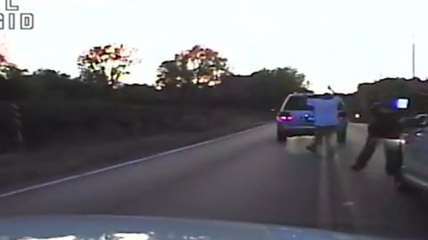 Video from a police dashcam shows Terence Crutcher with his hands up as he walks toward his vehicle.