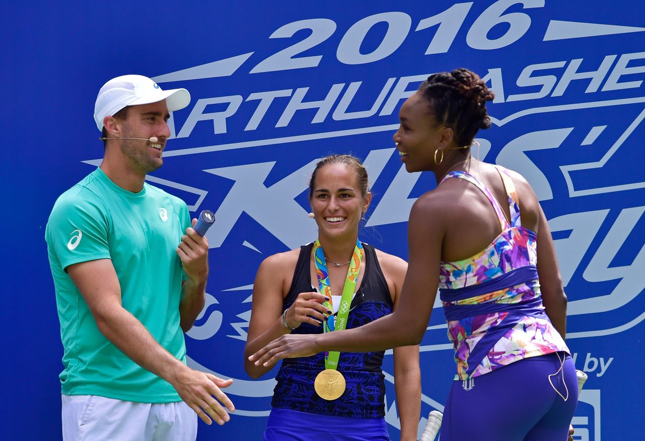 Puig took part in the Arthur Ashe Kids' Day with fellow tennis pros Steve Johnson and Venus Williams, but her first tournament after the Olympics ended with first-round defeats in both singles and doubles at the US Open.