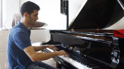 Aeham Ahmad practices at a piano shop in his adopted hometown of Wiesbaden, Germany.