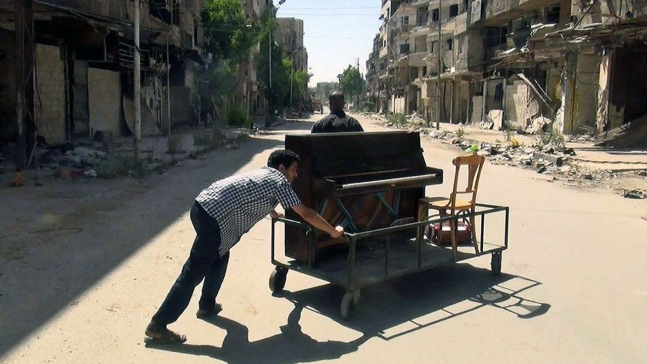 Aeham pushed his piano through the streets of Yarmouk to entertain residents of the besieged area.