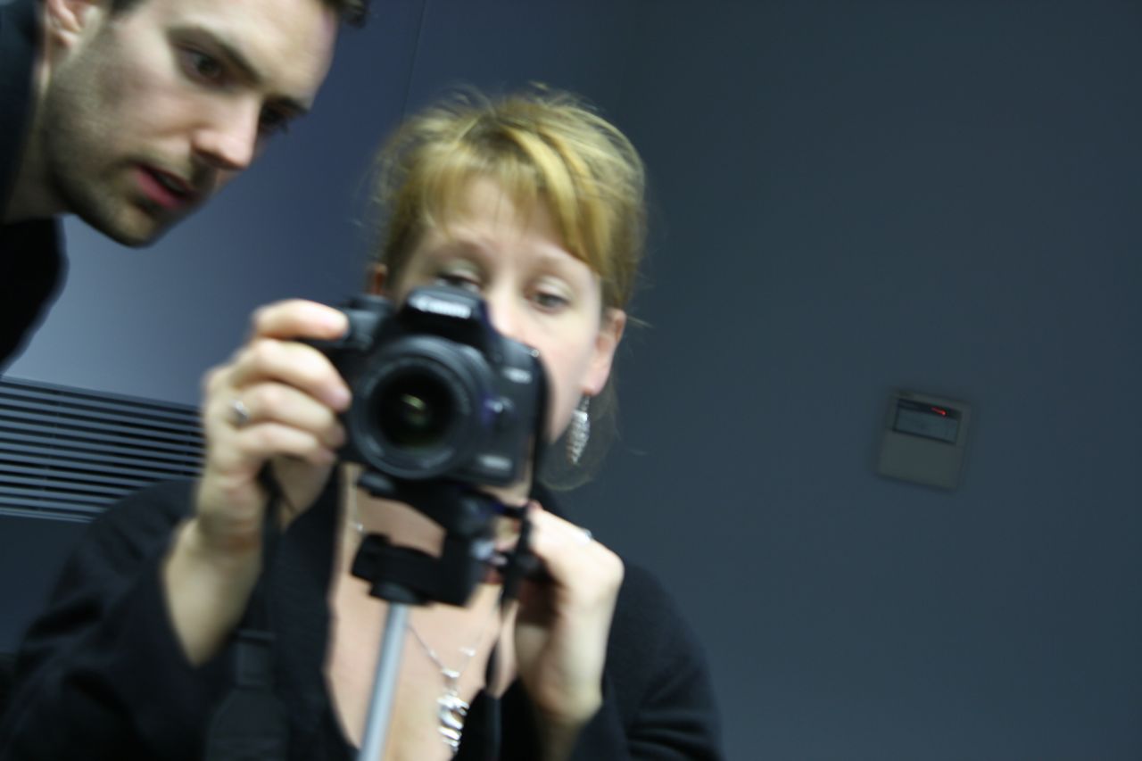 "Tanvir Bush with Matt Larsen-Daw of Photovoice" (2009) by Mikel Smithen