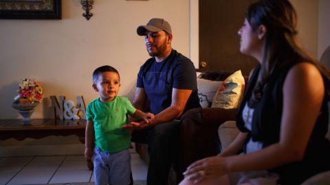 Freddy and Nancy Salazar relax at home with son Aydan, 2. "There is no racism between children," Freddy Salazar says.