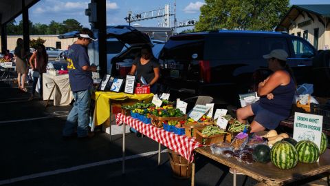 Fruits and veggies are plentiful at the Albertville Farmers Market. One vendor says immigrants work hard harvesting crops.