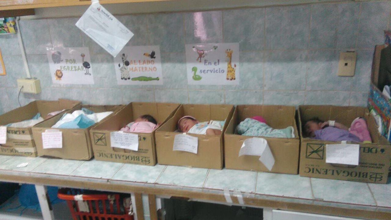 Newborn babies sleep inside cardboard boxes in a Venezuelan hospital.