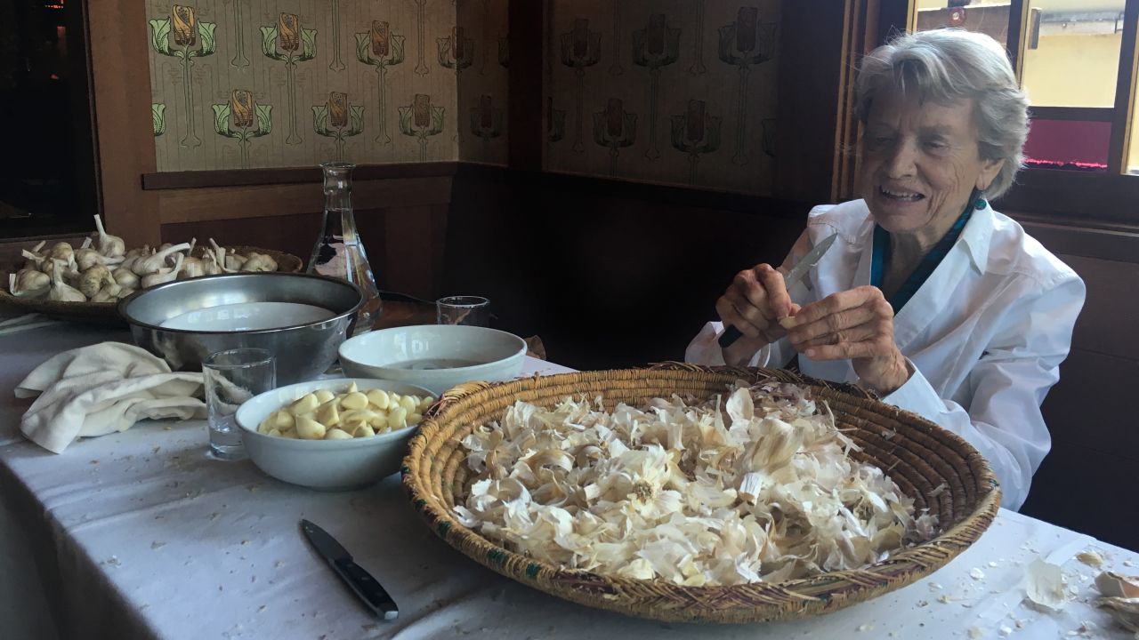 Ora Cipolla is one of three women (a fourth has passed away) who have helped peel garlic for the all-garlic Bastille Day feast for over 40 years. 