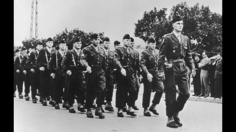 Chirac leads a French army regiment during a parade in 1956.