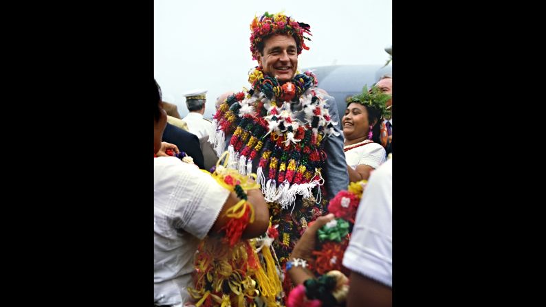 Chirac wears traditional leis as he arrives at the South Pacific island of Wallis in 1986.