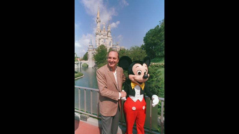 Chirac poses with Mickey Mouse during a trip to the United States in 1989.