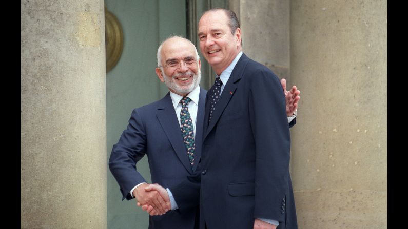 Chirac greets Jordan's King Hussein in Paris in 1997.