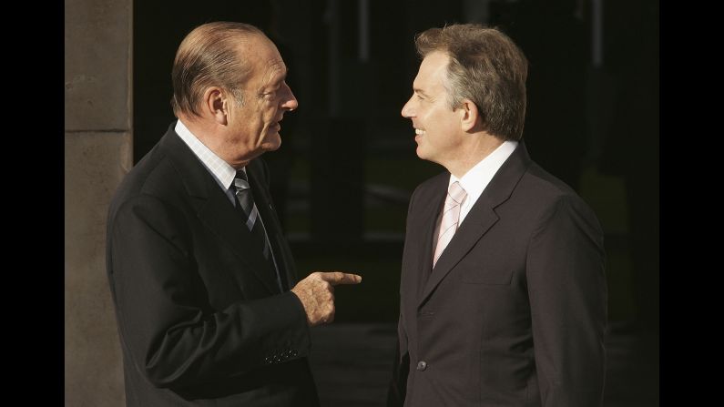 Chirac is welcomed by British Prime Minister Tony Blair in 2005.