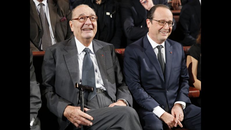 Chirac sits next to French President Francois Hollande during an award ceremony for the Jacques Chirac Foundation in 2014.