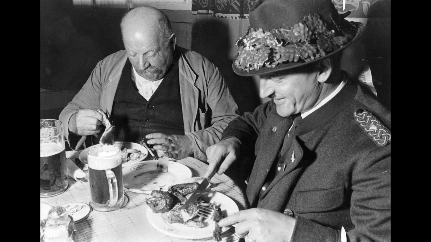 Visitors eat a meal during Oktoberfest celebrations in Munich in 1935.