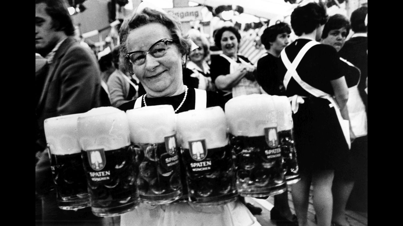 A waitress carries several glasses of beer in 1979. Munich <a href="http://www.cnn.com/2010/WORLD/europe/09/21/germany.oktoberfest/" target="_blank">prides itself on its quality of beer,</a> unashamedly calling it the best in the world. It cites Bavarian Purity Requirements that allow only water, hops and barley to be used in the brewing process.