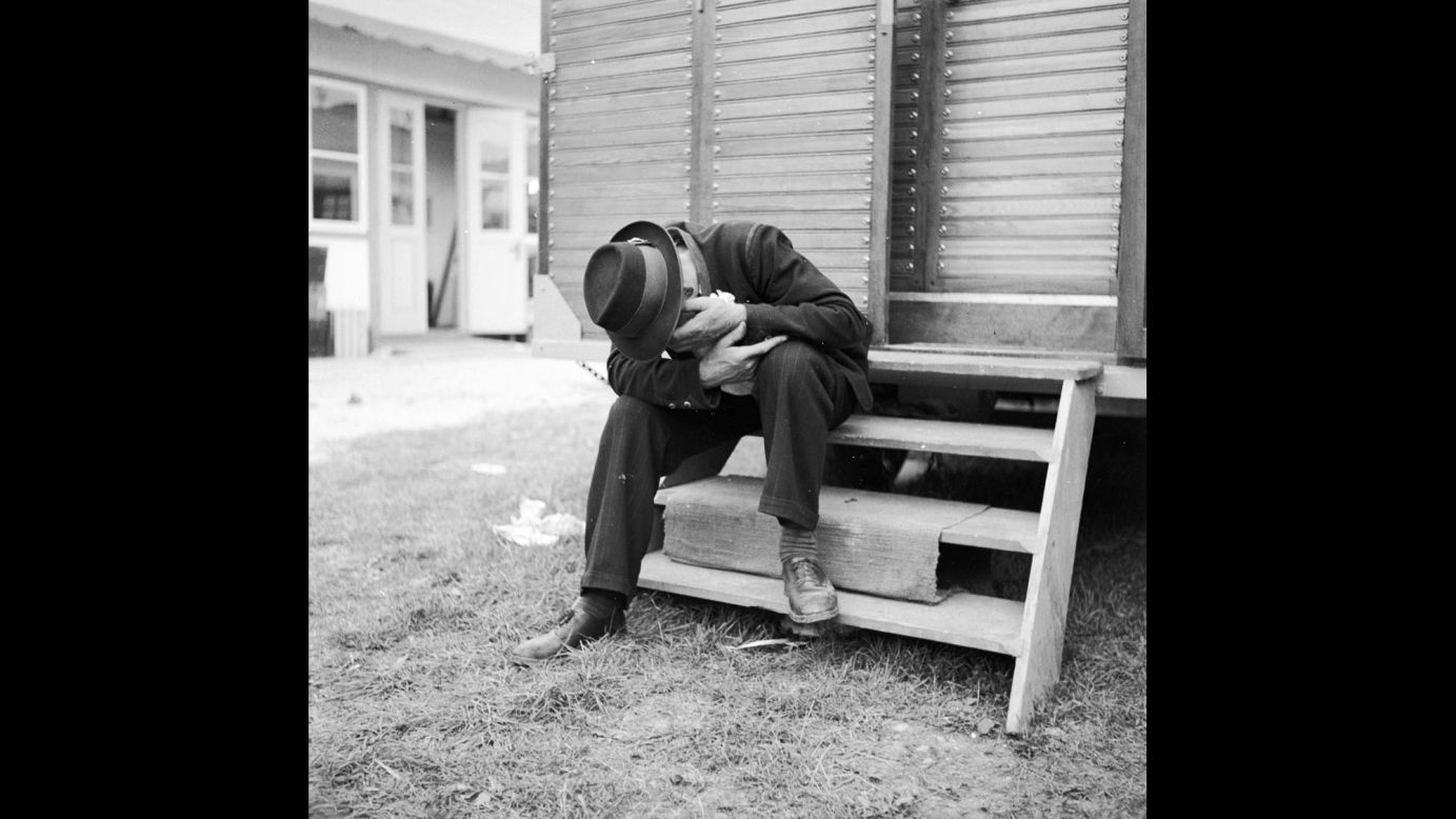 A hangover perhaps? A man lowers his head during Oktoberfest circa 1950.