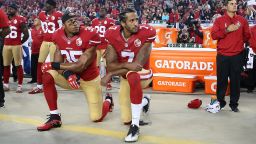 San Francisco 49ers Eric Reid and Colin Kaepernick take a knee during the National Anthem prior to their season opener against the Los Angeles Rams during an NFL football game on September 12, in Santa Clara, CA. 
