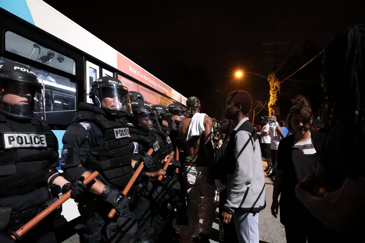 Police officers face off with protesters on the first night of demonstrations.