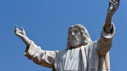 A picture taken on January 1, 2016 shows the nine-metre tall statue of Jesus Christ carved from white marble, thought to be the biggest of its kind in Africa, unveiled in Abajah, southeastern Nigeria.
Standing barefoot with arms outstretched, the "Jesus de Greatest" statue weighs in at 40 tonnes. More than 100 priests and hundreds of Catholic worshippers attended the nine-metre (30-foot) statue's official unveiling in the village of Abajah in southeastern Nigeria. It was commissioned by Obinna Onuoha, a local businessman who hired a Chinese company to carve it and placed it in the grounds of a 2000-capacity church that he built in 2012. / AFP / PIUS UTOMI EKPEI        (Photo credit should read PIUS UTOMI EKPEI/AFP/Getty Images)