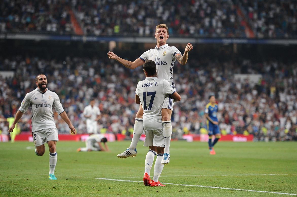 Toni Kroos celebrates with Lucas Vazquez after the German scored the winning goal in Real's win against Celta Vigo August 27.