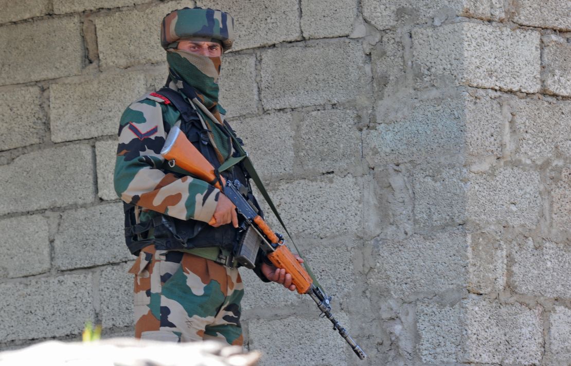 An Indian army soldier takes position during an army barracks attack, near the border with Pakistan, September 18, 2016.