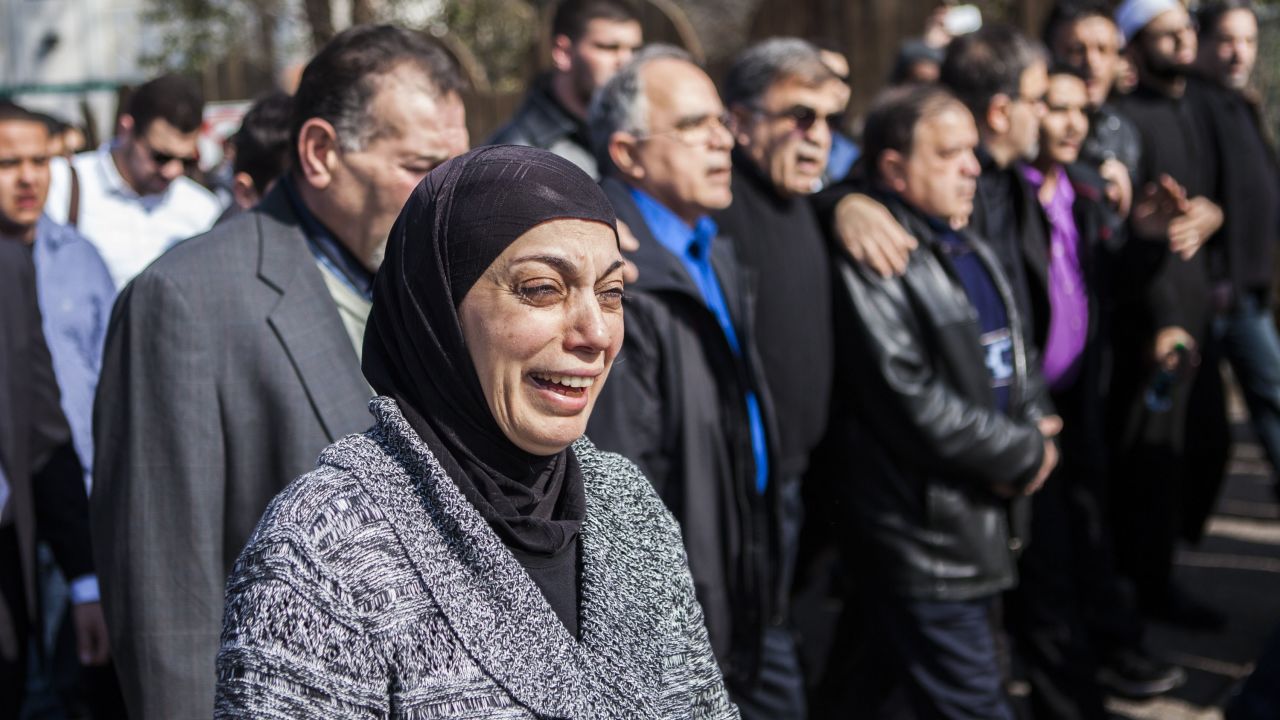Mourners in Raleigh, North Carolina, grieve the shooting deaths of three Muslim students in Chapel Hill in 2015.