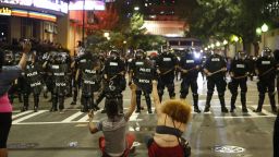 CHARLOTTE, NC - SEPTEMBER 21:  Police clash with protestors as residents and activists protest the death of Keith Scott September 21, 2016 in Charlotte, North Carolina. Scott, who was black, was shot and killed at an apartment complex near UNC Charlotte by police officers, who say they warned Scott to drop a gun he was allegedly holding.  (Photo by Brian Blanco/Getty Images)