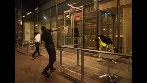 Protesters throw chairs at a restaurant on September 21.