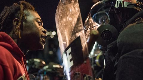 A protester stares down law enforcement officers during protests on September 21.