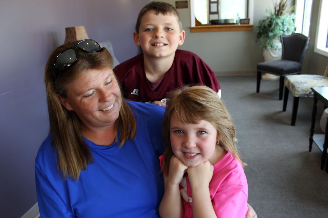 The Hill family, patients of Dr. Smith, show off their smiles