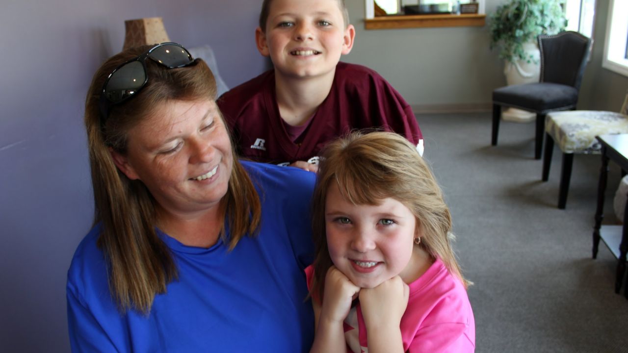 The Hill family, patients of Dr. Smith, show off their smiles